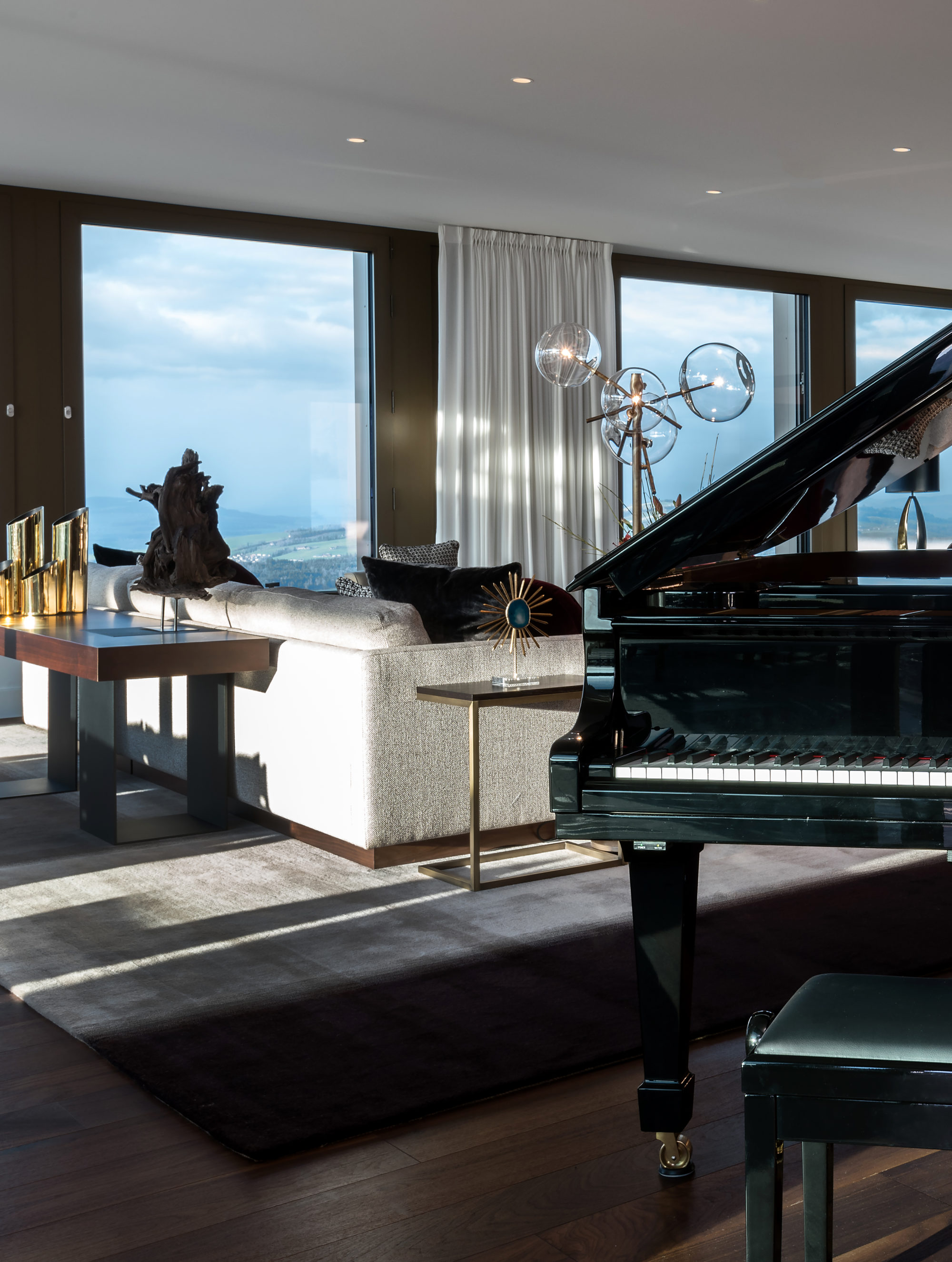 Living room with piano in president suite at Bürgenstock Resort